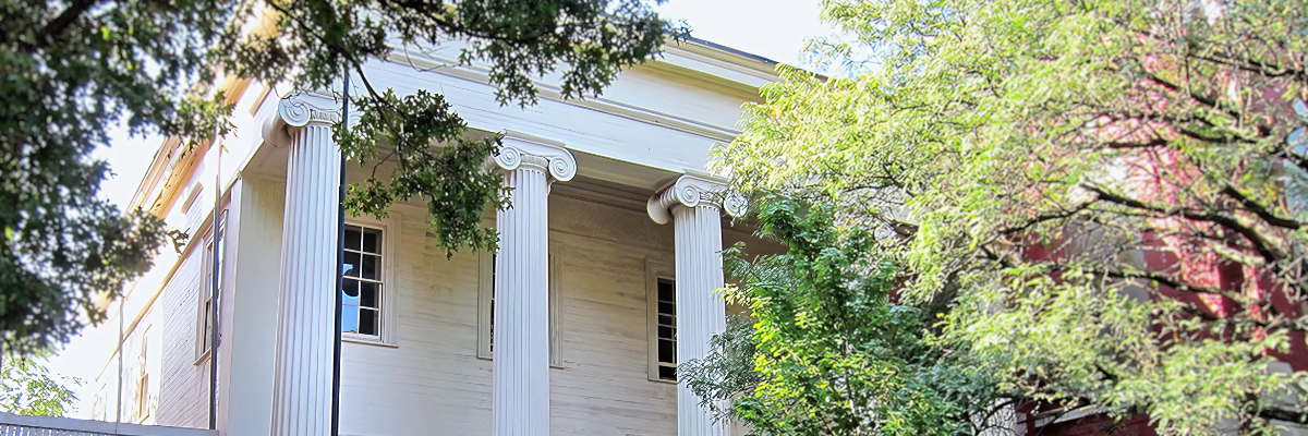 The front of the Barrow Mansion, prominently displaying the pillars